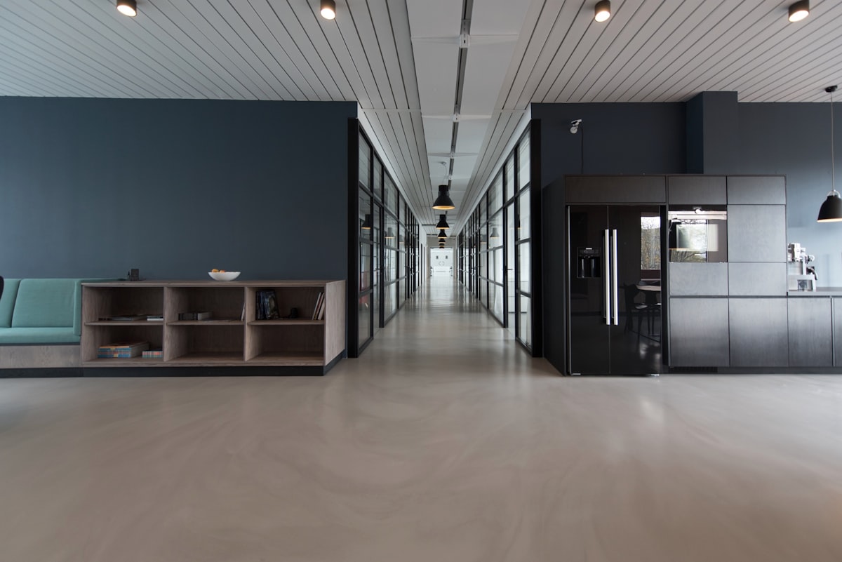 Maintained corridor in a modern facility with a clean suspended ceiling system
